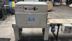 Automatic L-sealer with shrink tunnel.