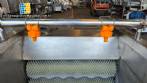 Washer and peeler for fresh fruits, vegetables, and tubers with abrasive brush roller.