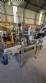 Automatic self-adhesive labeling machine for cylindrical bottles