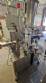 Automatic self-adhesive labeling machine for cylindrical bottles