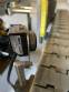 Automatic self-adhesive labeling machine for cylindrical bottles