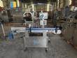 Automatic self-adhesive labeling machine for cylindrical bottles