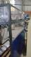 Pick and place product feeder for flowpack transfer cartoning machine