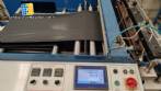 Complete line for manufacturing plastic bags and sacks