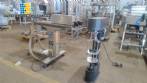 Filling machine with 2 nozzles for liquids and pilfer cap screwer