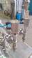 Filling machine with 2 nozzles for liquids and pilfer cap screwer