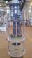 Filling machine with 2 nozzles for liquids and pilfer cap screwer