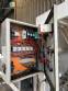 Automatic baling machine with shrink tunnel for bottles and jars in bales.