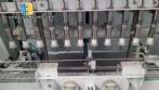Linear filling machine with stainless steel threading machine 12 Narita nozzles