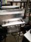 Automatic labeler for flat bottles