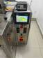 Automatic volumetric dosing packaging machine for powder products.