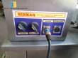Tempering machine with cover plate coupled to Sidmaq