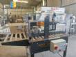 Adhesive tape case sealer with safety enclosure and door sensors Strapack