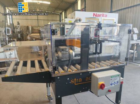 Adhesive tape case sealer with safety enclosure and door sensors Strapack
