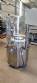 Bottle and jar screwing machine with automatic cap feeding system