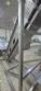 Inova Industrial inclined stainless steel conveyor belt with cleats.