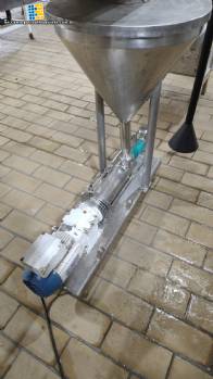 Netzsch positive displacement helical sanitary pump with feed hopper. Netzsch positive displacement helical sanitary pump with feed hopper.