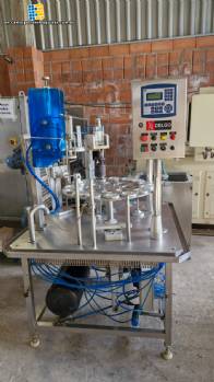 Stainless steel rotary sealer with aluminum seal for Delgo jars, cups and bottles.