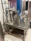 Stainless steel rotary sealer with aluminum seal for Delgo jars, cups and bottles.