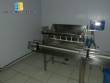 Linear filling machine with 14 nozzles with rinser and screw capper