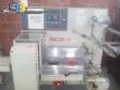 Varied flow pack wrapping machines