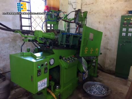 Factory line for the production of zipper sliders for clothing