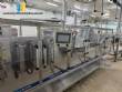 Horizontal stainless steel packaging machine for Profills stand-up pouch packaging.