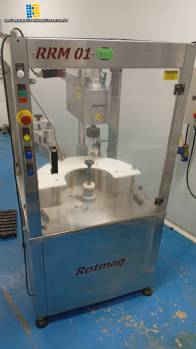 Rotmaq screw capping machine with cap positioning elevator