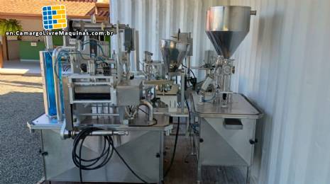 Delgo rotary bottle and jar filling machine for pasty, sweet, and dairy products.