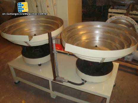 Positioner for vibratory feeder for double time