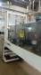 Labeling machine with steam sleeve tunnel and bottle baler
