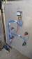Labeling machine with steam sleeve tunnel and bottle baler