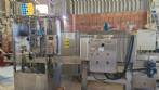 Labeling machine with steam sleeve tunnel and bottle baler