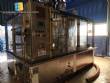 Zegla rotary filling machine with rinser and three-block capping system.