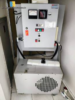 Automatic stainless steel induction lid sealer for GRC jars and bottles.