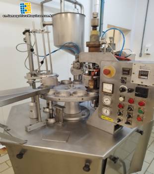 Stainless steel rotary filling and sealing machine for jars, cups, and bottles, Brasholanda, capacity 1,700 jars per hour.