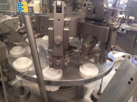 Automatic bottle cap and closure of aluminum tube Comadis