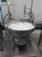 Filling line with capsule counter and screw machine