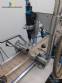 Filling line with capsule counter and screw machine