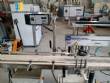 Automatic labeling machine for flat products