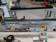 Automatic labeling machine for flat products