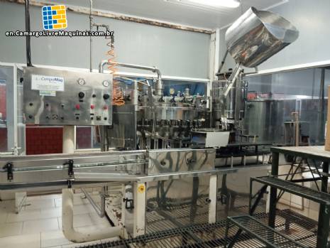 Stainless steel rotary filling machine for carbonated beverages and soft drinks, 30 nozzles, CompoMaq with capping unit. Stainless steel rotary filling machine for carbonated beverages and soft drinks, 30 nozzles, CompoMaq with capping unit.